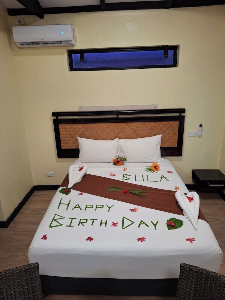 A villa bedroom with garden light