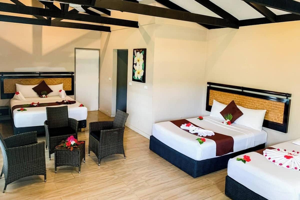 King Family Villa — the separate bedroom with twin, double, and queen beds