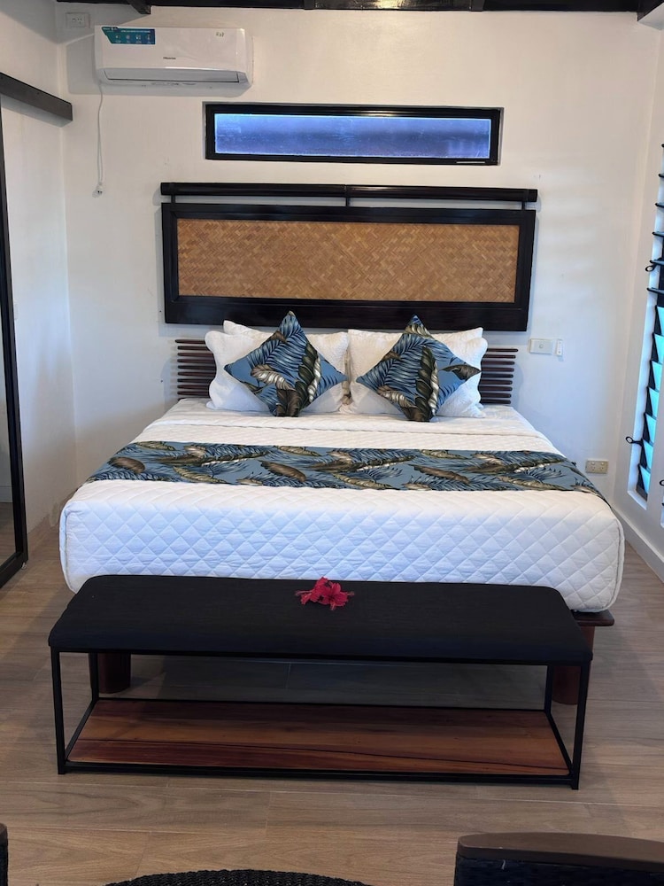 Luxury Villa — a spacious pool-view room with a king bed and patio