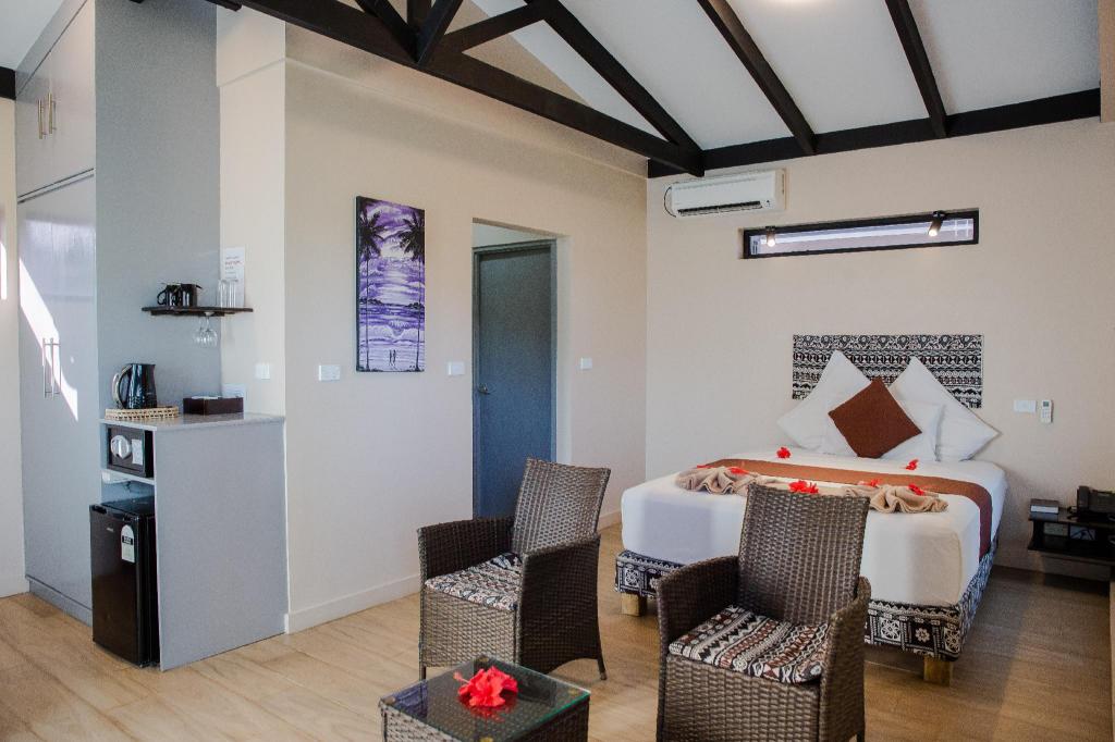Bulabard Villas — a spacious pool-view room opening onto the patio